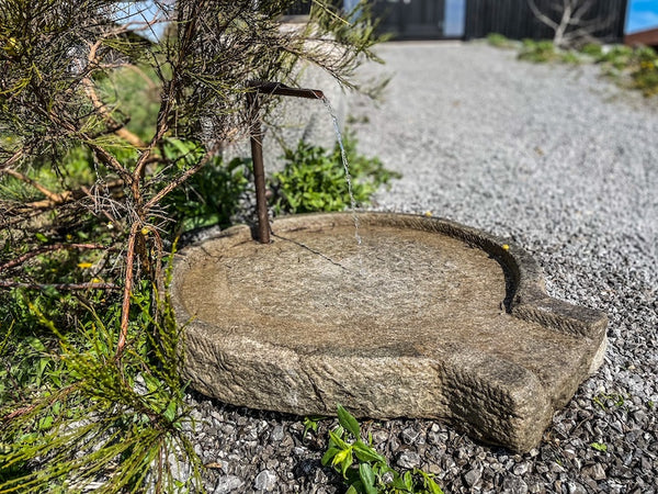 Brunneneinlauf aus Stein