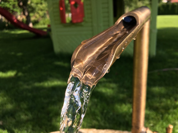 Mühlsteinbecken mit Auslauf